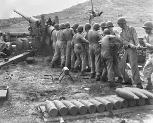 Teamwork Prints: U.S. Marines cleaning artillery on Guam Island