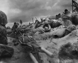 Lcgr1310 Prints: U.S. Marines take cover from Japanese fire behind a sea wall on Red Beach #3