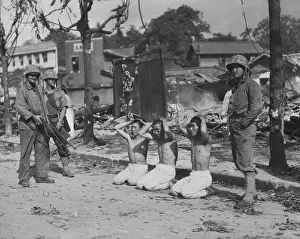 Guards Prints: U.S. Marines guarding three captured North Koreans
