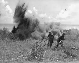 Explosions Prints: U.S. Marines just after throwing a TNT charge into a Japanese dugout in Saipan
