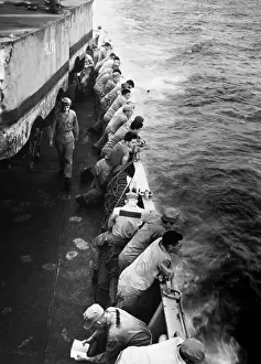 South Korea Prints: U.S. Marines stand along the rail of the USS Clymer taking them to Korea in late July