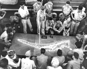 Tarawa Prints: U.S. Marines study a relief model of Tarawa Atoll on a Navy transport before the battle