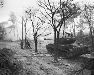 Tanks Prints: U.S. Marines, supported by one of their tanks, mop up heights on Wolmi Island