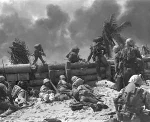 Advancing Prints: U.S. Marines move out from the Tarawa beachhead into Japanese smoke covered airstrip