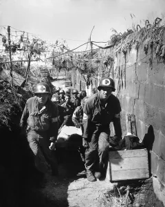 Red Cross Prints: U.S. Medics remove a casualty from the battle field to an aid station