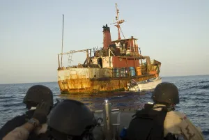 Piracy Prints: U.S. Navy and Coast Guard personnel approach a suspected pirate mothership in the Gulf of Aden