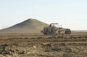 Images Dated 16th March 2011: U.S. Navy Seabees run heavy graders down the runway to patch holes
