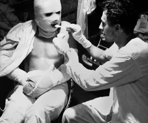 Sailor Prints: U.S. sailor dressed in pressure bandages after suffering burns during a Kamikaze attack