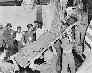 Litters Prints: U.S. soldier is lifted from a Air Force C-47 in Japan from an airstrip near the battle front in Korea
