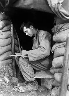 Bunkers Prints: U.S. soldier writes a letter during a break along the fighting front in Korea