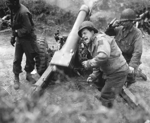 Explosives Prints: U.S. soldiers fire a 105-mm howitzer during the fighting at Carentan