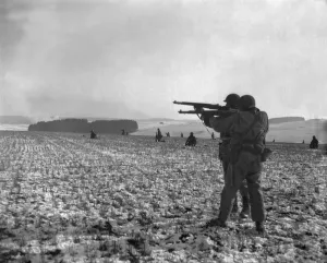 Belgium Prints: U.S. soldiers fire at Germans positions to relieve besieged airborne troops in Bastogne