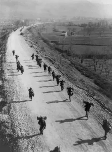 Mediterranean Region Prints: U.S. soldiers marching along Italy's Highway 6, south of Cassino, Jan. 31, 1944