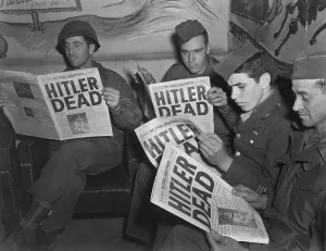Newspapers Prints: U.S. Soldiers read of Hitler's death in an Extra edition of Starts and Stripes
