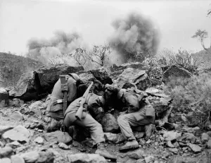 Mortars Prints: U.S. soldiers behind rocks to shield themselves from exploding mortar shells
