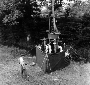 Logs Prints: U.S. soldiers showering in an installation mounted along a hedgerow in Normandy