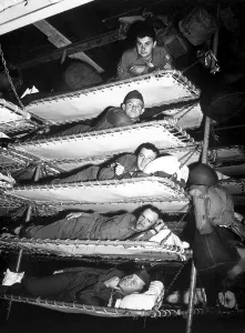 Crowded Prints: U.S. soldiers in five tier bunks on Army troop ship