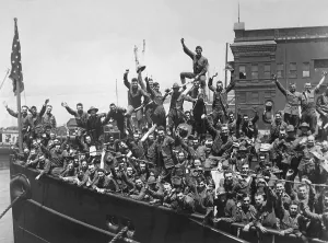 Recruitment Prints: U.S. Soldiers wave from a troop ship embarked for France. World War I. 1917