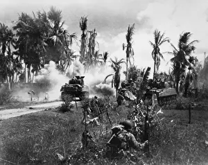 Tanks Prints: U.S. Troops take cover behind advancing tanks while moving up on Japanese positions