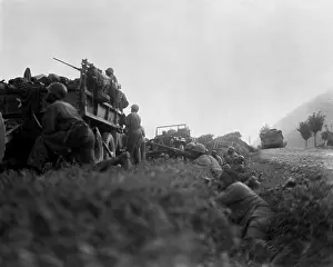 Trucks Prints: U.S. troops shelter in a ditch while under fire from North Korean invaders