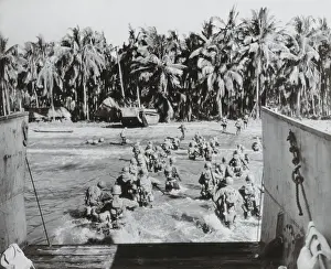 Palm Trees Prints: U.S. troops wade ashore, across heavily mined beaches