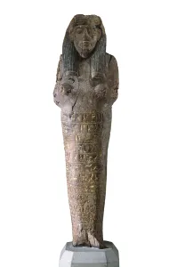 Ushabti with inscriptions. 1554 BC. Polychrome wood. Egyptian art. New Kingdom. Sculpture on wood. SPAIN. Madrid. National Museum of Archaeology