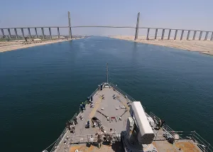 June Prints: The USS ASHLAND an amphibious warship approaching the Mubarak Peace Bridge over the Suez Canal