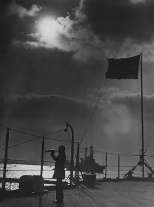 Standards Prints: On the USS PENNSYLVANIA, a bugler sounds a call on the fantail