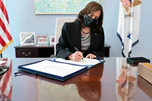 Asian American Prints: Vice President Kamala Harris signs two bills in her West Wing Office