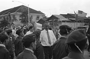 Lyndon Prints: Vice-President Lyndon Johnson among group of Vietnamese soldiers and Americans