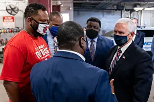 Epidemic Prints: Vice President Mike Pence, wears a black facemask decorated with a Presidential seal