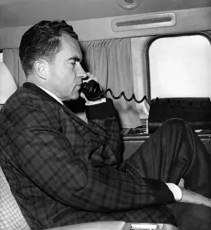Profiles Prints: Vice President Richard Nixon uses his plane's radiotelephone while enroute from Quito