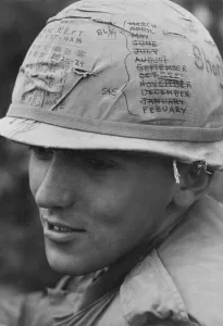 Republic Of Vietnam Prints: Vietnam War. A US Army sky trooper helmet keeps track of the months time he has left on his thirteen month tour of duty