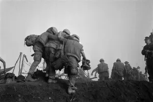 Republic Of Vietnam Prints: Vietnam War. A US Marine is helped to an evacuation point after he was wounded during Operation Dewey Canyon