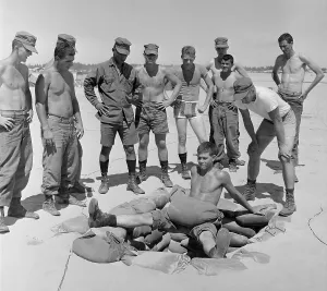 Exercise Prints: Vietnam War. US Marine Lieutenant instructs soldiers in an extreme leg
