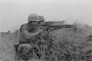 Republic Of Vietnam Prints: Vietnam War. US Marine machine gunner and rifleman fire at the enemy near the Demilitarized Zone in Vietnam