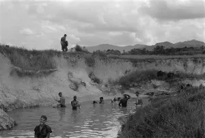 Cleaning Prints: Vietnam War. US Marines bathe in the stream at the base of Hill 51