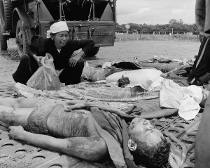 Dead Body Prints: Vietnam War. South Vietnamese soldier's widow weeps over the body of her husband