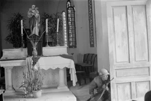Republic Of Vietnam Prints: Vietnam War-Tet Offensive. US Marine crouches behind a church door during the Battle of Hue