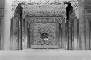 Republic Of Vietnam Prints: Vietnam War-Tet Offensive. US Marine Sergeant sits on a throne in the palace in the old city of Hue