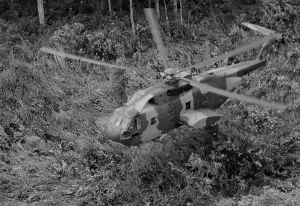 Proxy Wars Prints: Vietnam War. An unmarked US Air Force helicopter landing in Southeast Asian jungle during operation Pony Express