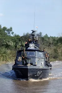 Vietnam Prints: Vietnam War, U.S. Navy inshore patrol craft PCF-38 of Coastal Division 11 patrols the Cai Ngay Canal