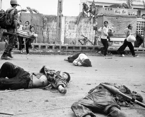 Vietnam Prints: Vietnam War, women and children loaded down with salvage