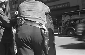 Revolvers Prints: Back view of a deputy sheriff with a gun on his hip during the September 1935 strike in Morgantown