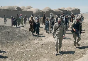 Candid Group Portrait Prints: Villagers from Nojoy outside Kandahar International Airport follow the members of the U.S