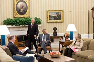 Clinton Prints: VP Joe Biden and Pres. Obama grip hands as he arrives for a meeting in the Oval Office