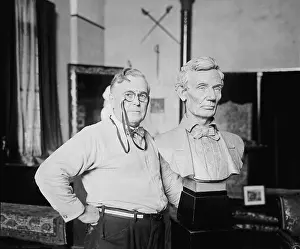 Sculptor Prints: W. Clark Noble (1858-1938) poses next to his bust of Abraham Lincoln, 1924