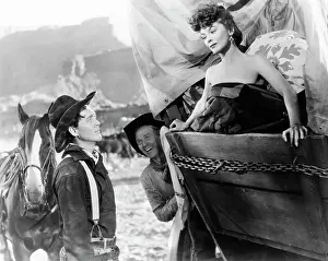 Carey Prints: WAGON MASTER, (aka WAGONMASTER), from left: Ben Johnson, Harry Carey Jr. Joanne Dru, 1950