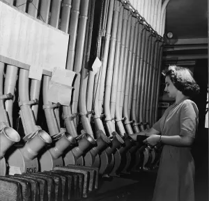 Networks Prints: Washington D.C. bank worker Helen Ringwald sends messages to other bank branches of the city through pneumatic tubes