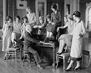 Hair Fashions Prints: Washington Debs rehearsing for comedy with a man at a piano